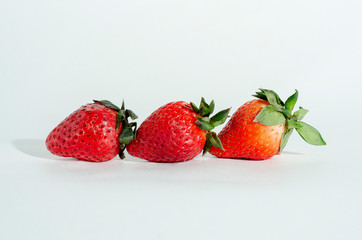  fresh strawberries. white background. crop 2019. one or several