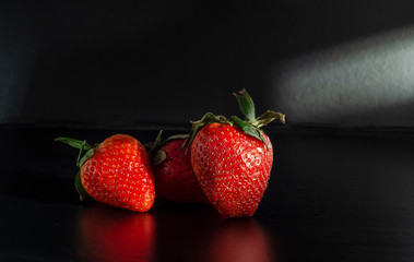  fresh strawberries. black background. crop 2019. one or more. Healthy food. Healthy lifestyle