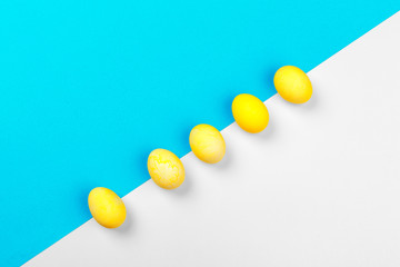 Candy color easter eggs over bright paper background