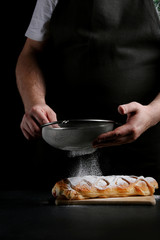 baker decorating on dark background. recipe concept