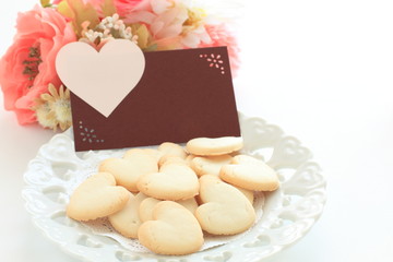 Hand written Valentine's day card and heart shaped cookie