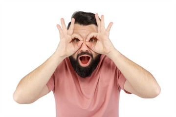 A cute young bearded man shows glasses