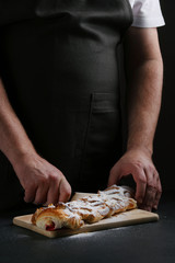 pie on dark with hand. concept of decorating bakery. pie making concept