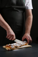 baker decorating on dark background. recipe concept