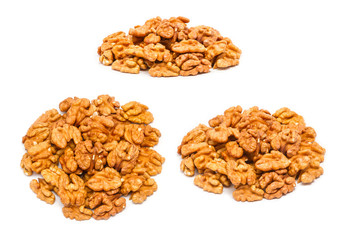 Set of handfuls of nuts from different angles - peeled walnut (Juglans regia) without shell, close up, isolated on white background