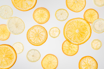 bright orange and lemon slices on grey background