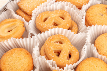 A closeup photo of Danish butter cookies in the traditional tin box