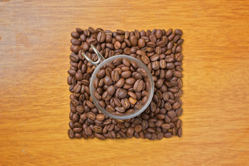 cup with coffee beans - square