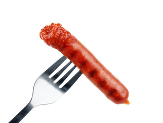 Delicious sausage on a fork, isolated on white background