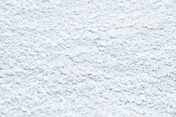 Fresh snow background texture. Winter background with snowflakes and snow mounds. Snow lumps.