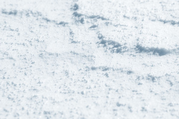 Fresh snow background texture. Winter background with snowflakes and snow mounds. Snow lumps.