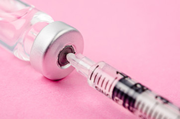 Vaccine vial dose with needle syringe.