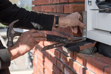 dutch building specialist at work - building a window sill