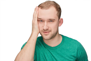 A funny young man in a green shirt shows