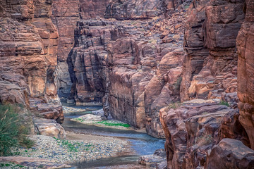 incredibly impressive and beautiful canyon with rocky cliffs in the national park of Jordan Wadi...