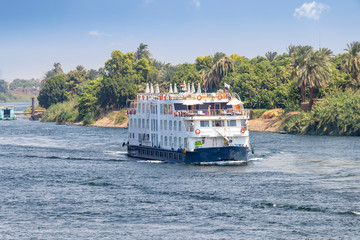  A Tourist boat motor down the River Nile towards Aswan in central Egypt. The tourist boats cruise...