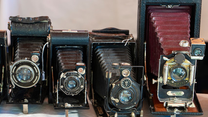Photo the old photo cameras. Antique folding cameras.