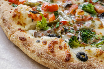Vegetarian pizza closeup. Appetizing crisp freshly baked pizza.    