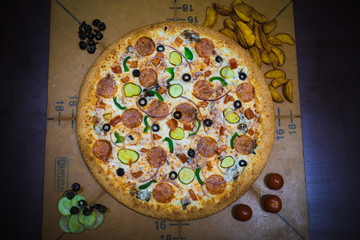 A whole big pizza close-up on a gray background. Colorful pizza topping closeup