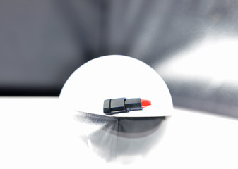 lipstick and cosmetic products with lens ball