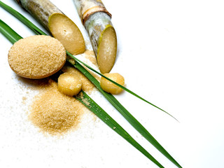 sugar cane and leaf with brown sugar