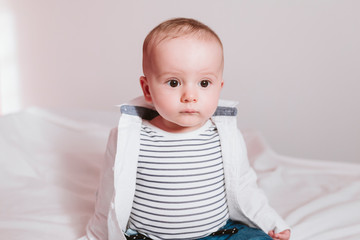 close up portrait of baby boy on bed. Family concept