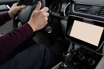 Naklejka premium Senior driver is using navigation is his car
