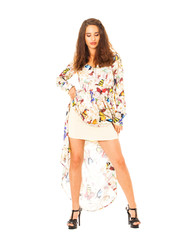 Portrait in full growth the young beautiful brunette woman in long dress