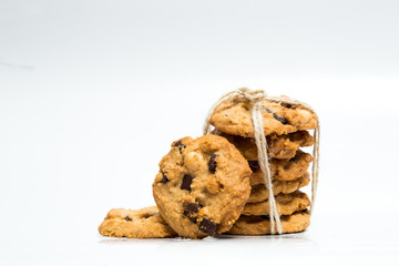 A stack of chocolate chip cookies isolated on a white background
