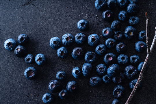 Closeup image of fresh ripe blueberries on dark background