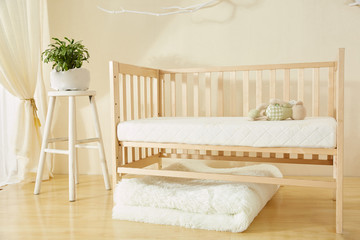 Fototapeta na wymiar Shelves with hanger in modern baby room