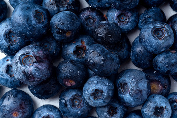 Macro shot of fresh ripe blueberries on white background