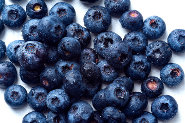 Macro shot of fresh ripe blueberries on white background