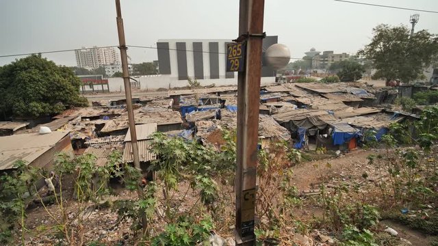 Slums of India from a moving train.