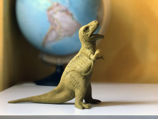 Tyrannosaurus rex on white background. Dinosaur toy