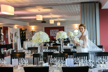 Joyful bride holding beautiful bridal bouquet