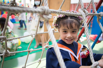 Happy little girl graduated at school 