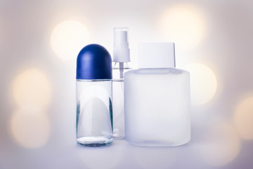 cosmetic glass bottles liquid product fresh icy sparkling magical background water drops glitter soft blur focus beautiful natural bokeh blue wintry refreshing tones