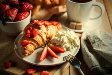 Delicious continental breakfast with fresh flaky croissantsl and coffee
