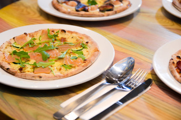 Slice of hot pizza cheese lunch or dinner crust seafood meat topping sauce with bell pepper vegetables delicious tasty fast food italian traditional on wooden board table classic with delivery hand 