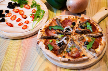 Slice of hot pizza cheese lunch or dinner crust seafood meat topping sauce with bell pepper vegetables delicious tasty fast food italian traditional on wooden board table classic with delivery hand 