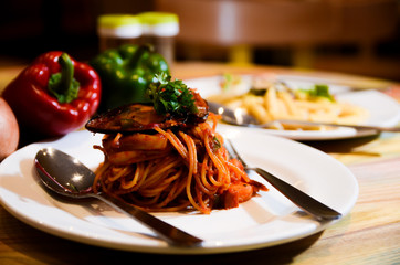 Delicious pasta with seafood, food on the table
