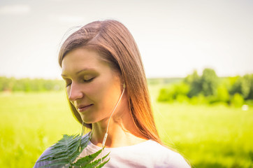 Young woman enjoying music in white headphones outdoors