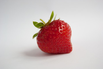 Single fresh and ripe strawberry