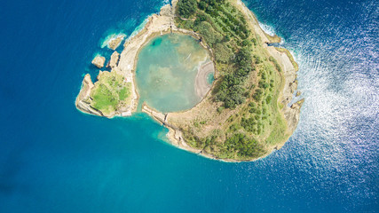 Obraz premium Top view of Islet of Vila Franca do Campo is formed by the crater of an old underwater volcano near San Miguel island, Azores, Portugal. Bird eye view, aerial panoramic view.