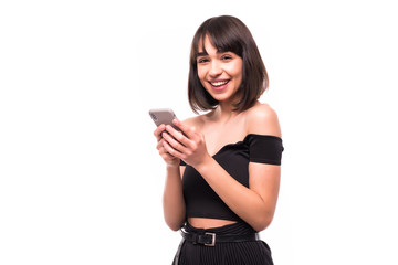 Naklejka premium Beauty woman using and reading a smart phone on a white background