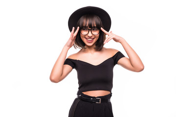 Portrait of young woman in black floppy hat thinking on white background