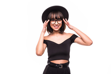 Portrait young elegant woman in blackshorts, black shirt and floppy hat on white background.