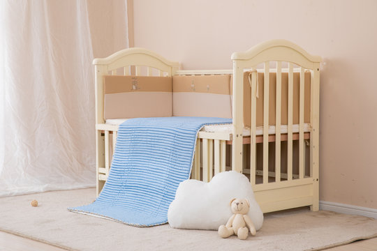 White children's beds, blue mattresses