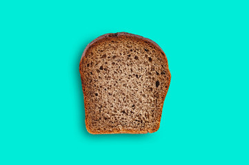 One rectangle piece of fresh rye bread in center of green table on kitchen. Top view. Dieting concept
